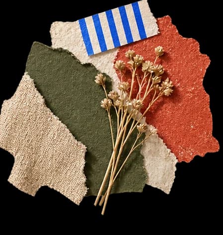 Torn olive and terracotta papers, woven linen, striped tape and delicate dried flowers.
